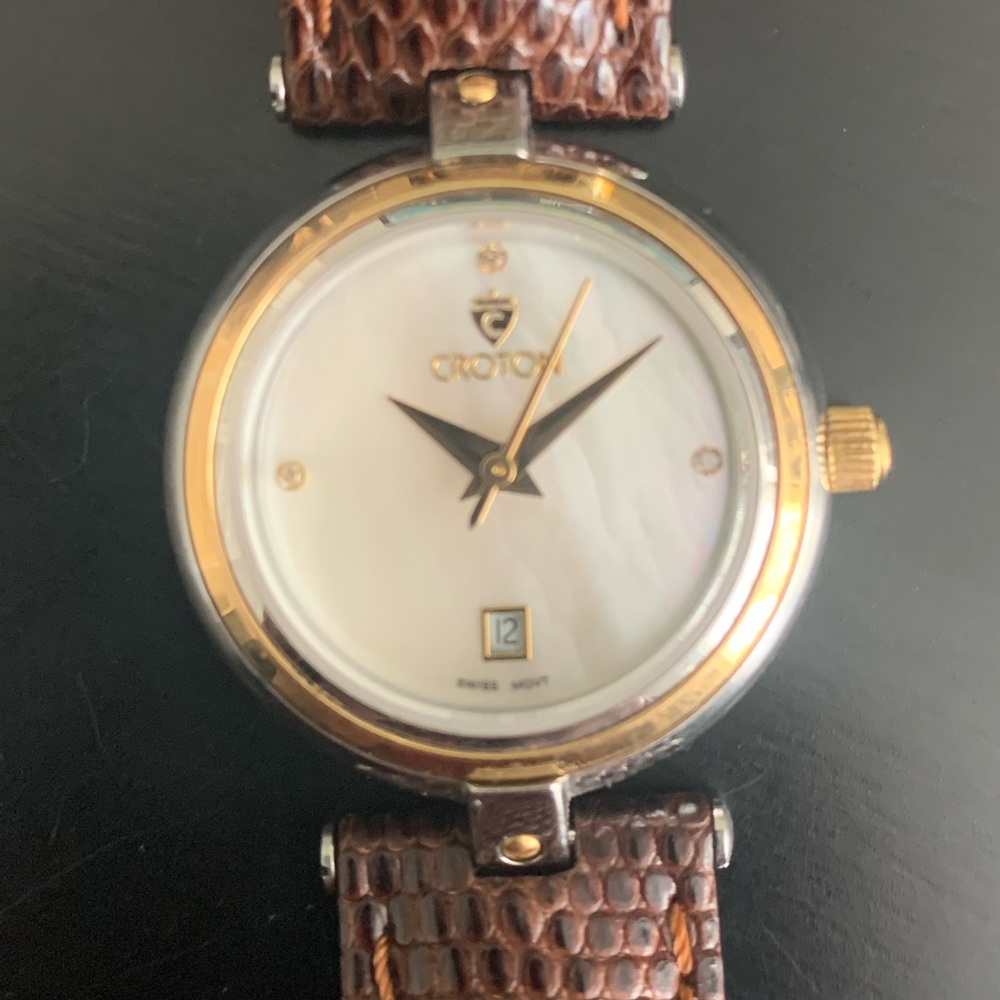 Womens Croton watch with lizard strap and mother of pearl face